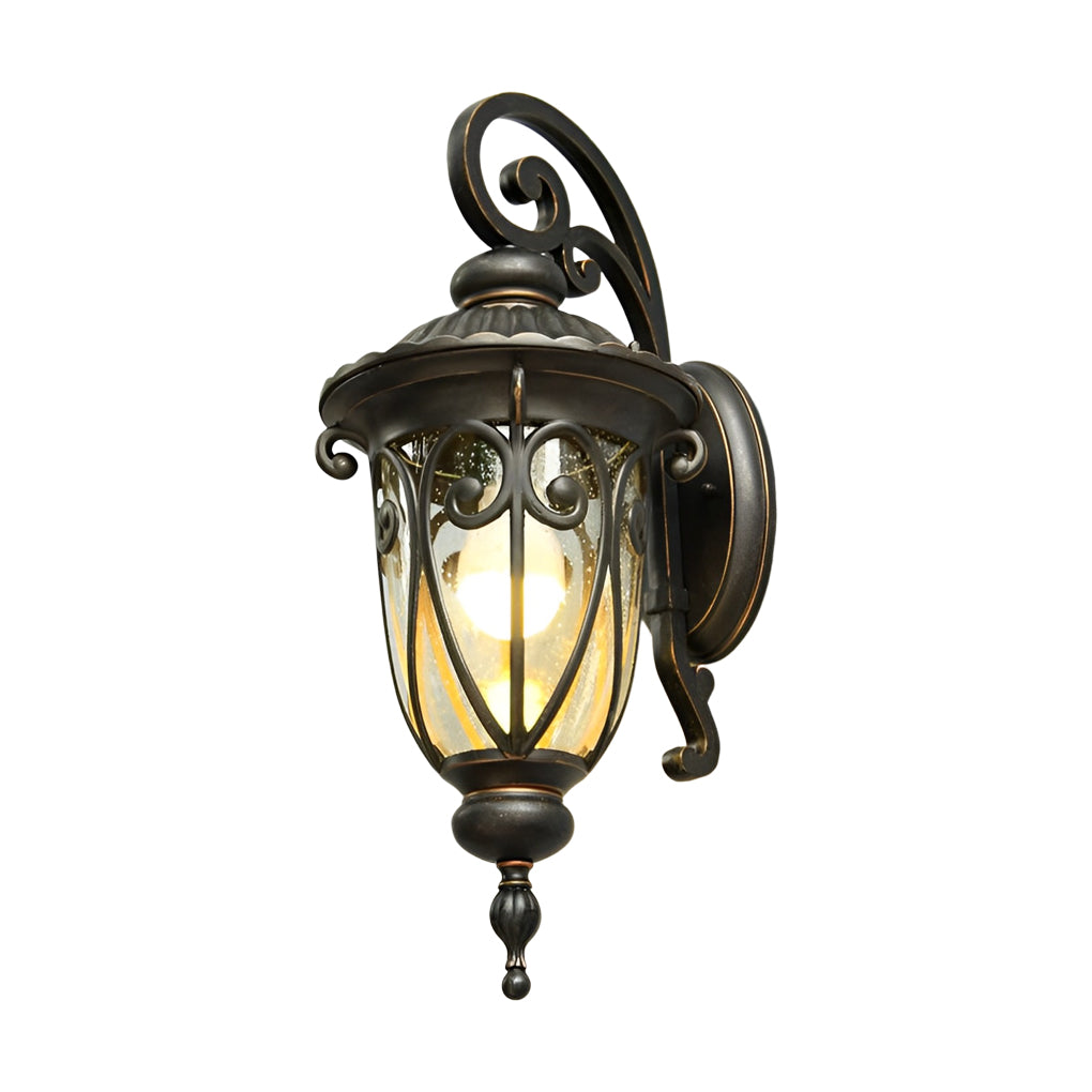 Black outdoor lantern sconce detail, emphasizing the ornate scrollwork and durable finish.