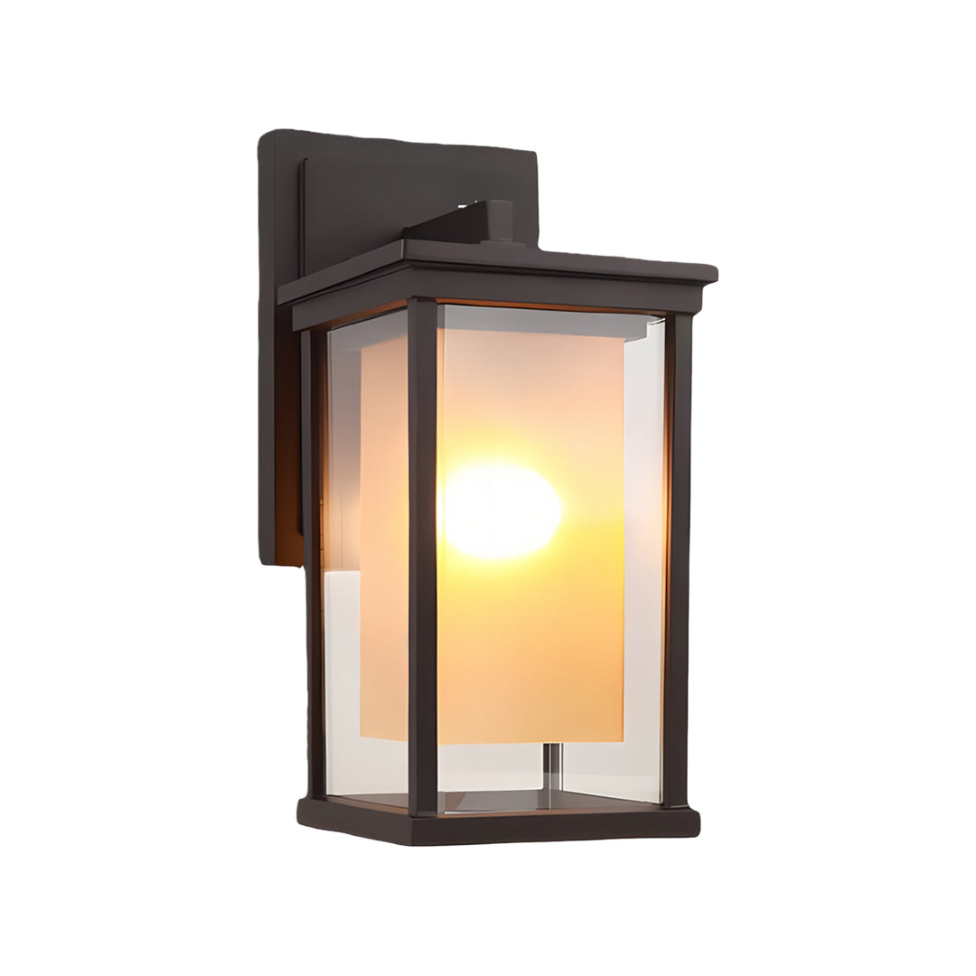 Close up of black outdoor wall mounted light with clear glass panels, perfect for contemporary exterior spaces.