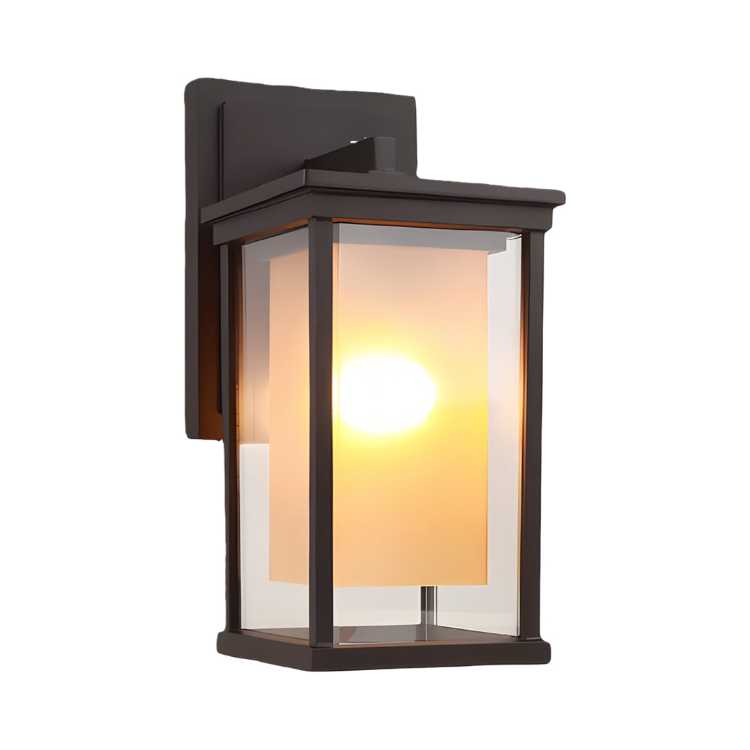 Black outdoor wall mounted light fixture with warm glow, ideal for modern home exteriors and porches.
