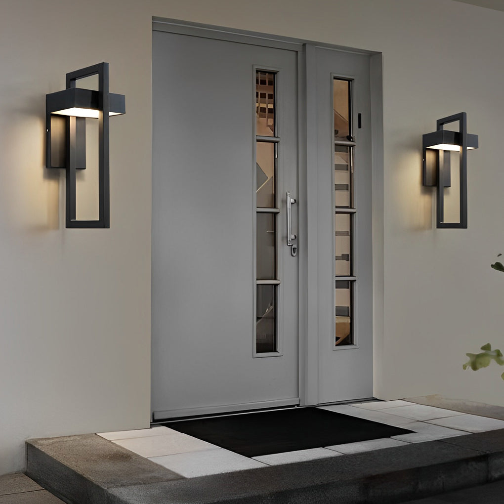 Pair of black outdoor wall sconce modern installed symmetrically on a concrete exterior wall.