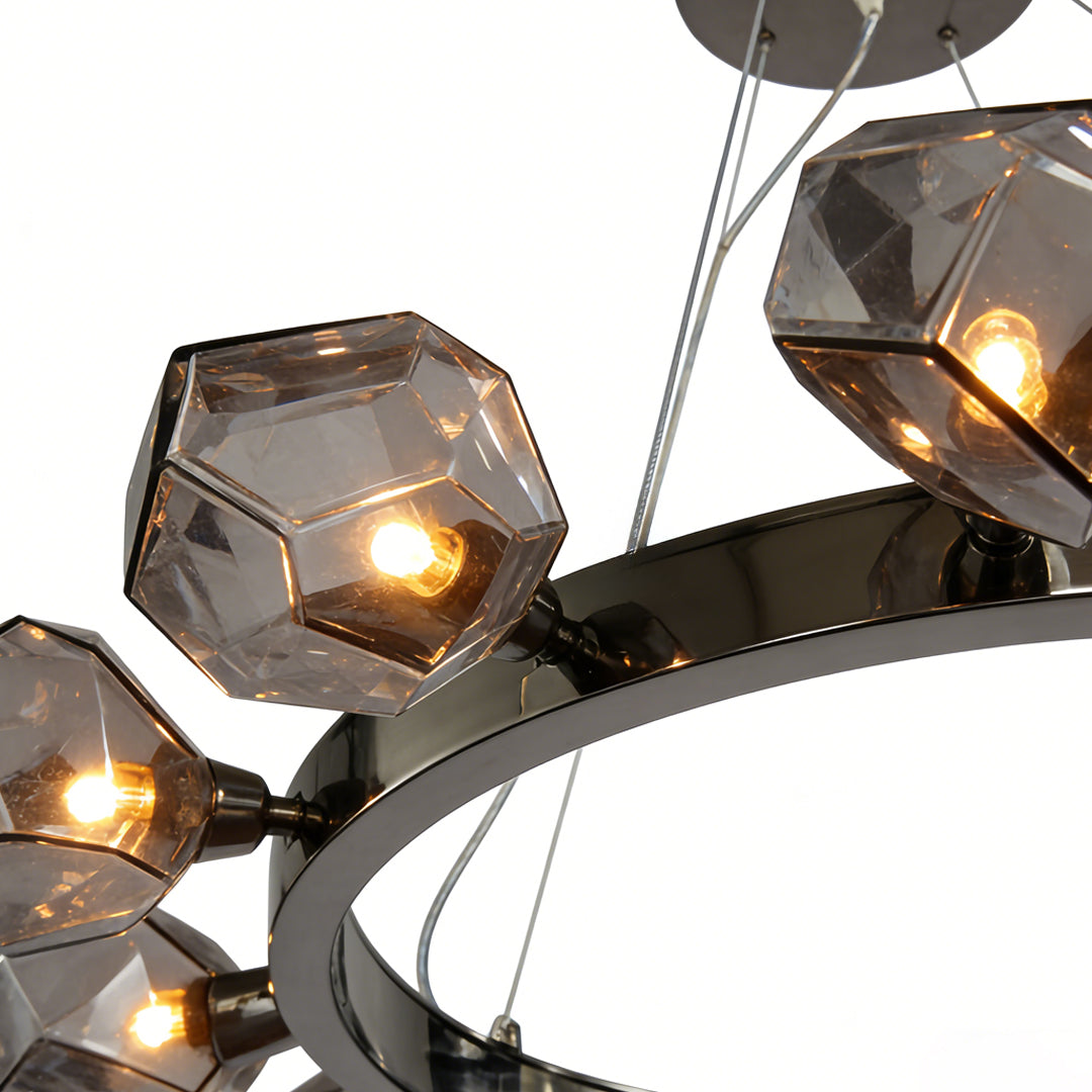 Close up of a black round chandelier with multiple smoked glass pendants and minimalist circular design.