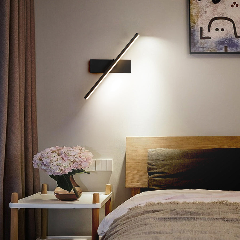 Close-up of a black swivel wall light fixture, showcasing its sleek design and adjustable arm for flexible lighting.
