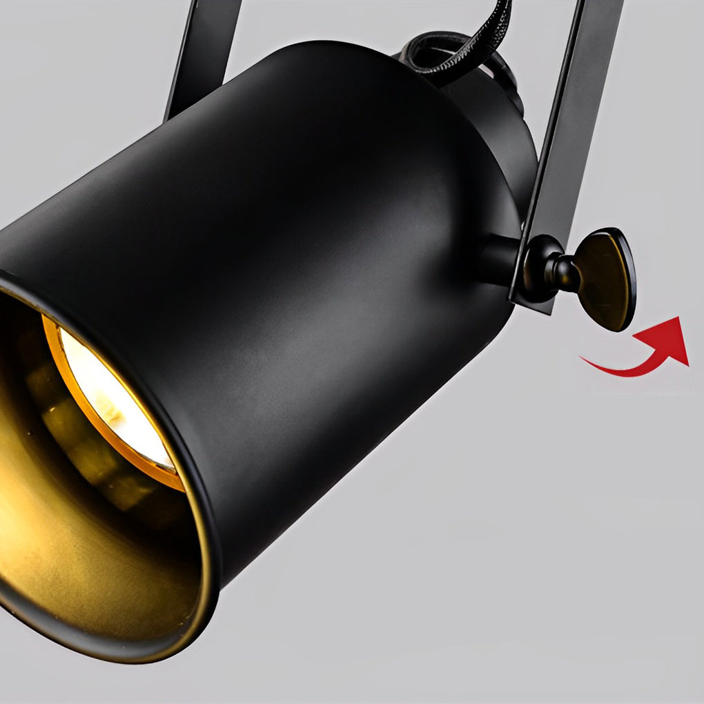 Close up of a black track light fixture with a gold interior, showcasing its design.