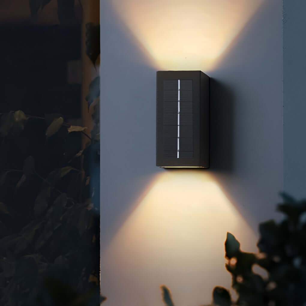 Black up down wall light installed on modern exterior wall