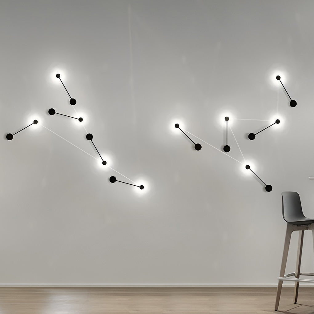 Black wall light with close-up of its sleek design and light output.