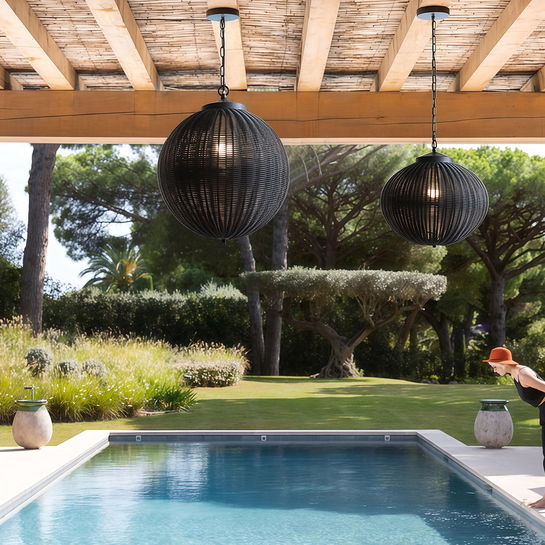 Black woven pendant lights hanging in a contemporary kitchen, adding a sophisticated and chic vibe.