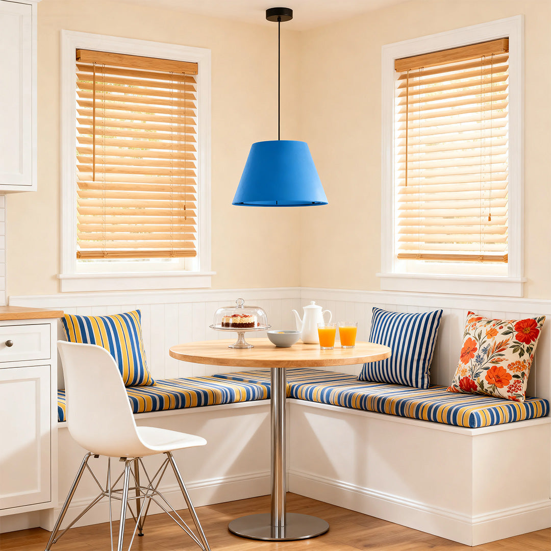 blue hanging pendant lights illuminating a cozy kitchen nook with natural wood blinds