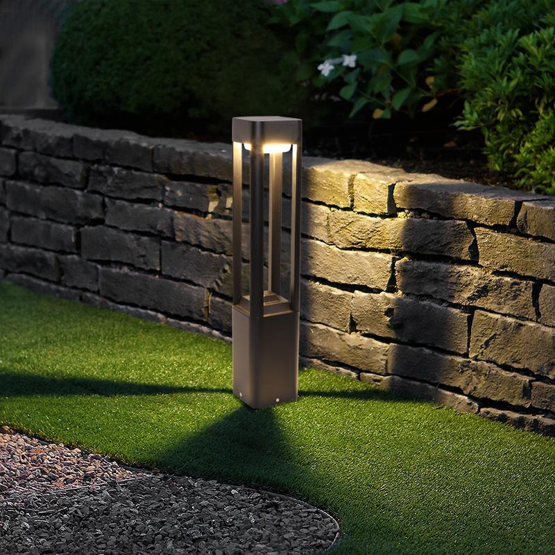Bollard landscape lighting illuminating an outdoor deck area