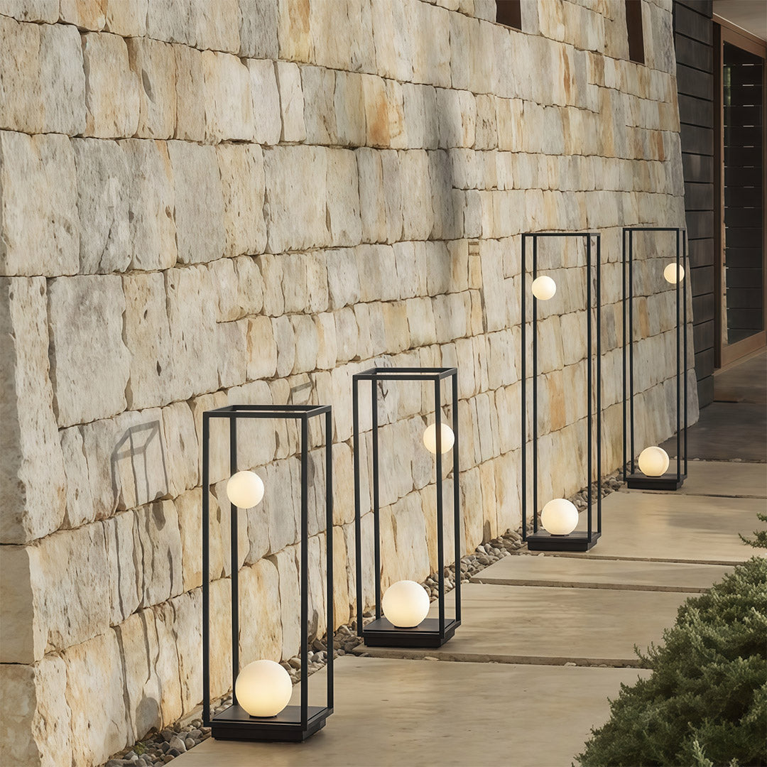 Close-up of bollard outdoor light, highlighting its contemporary design with spherical illumination for outdoor settings.