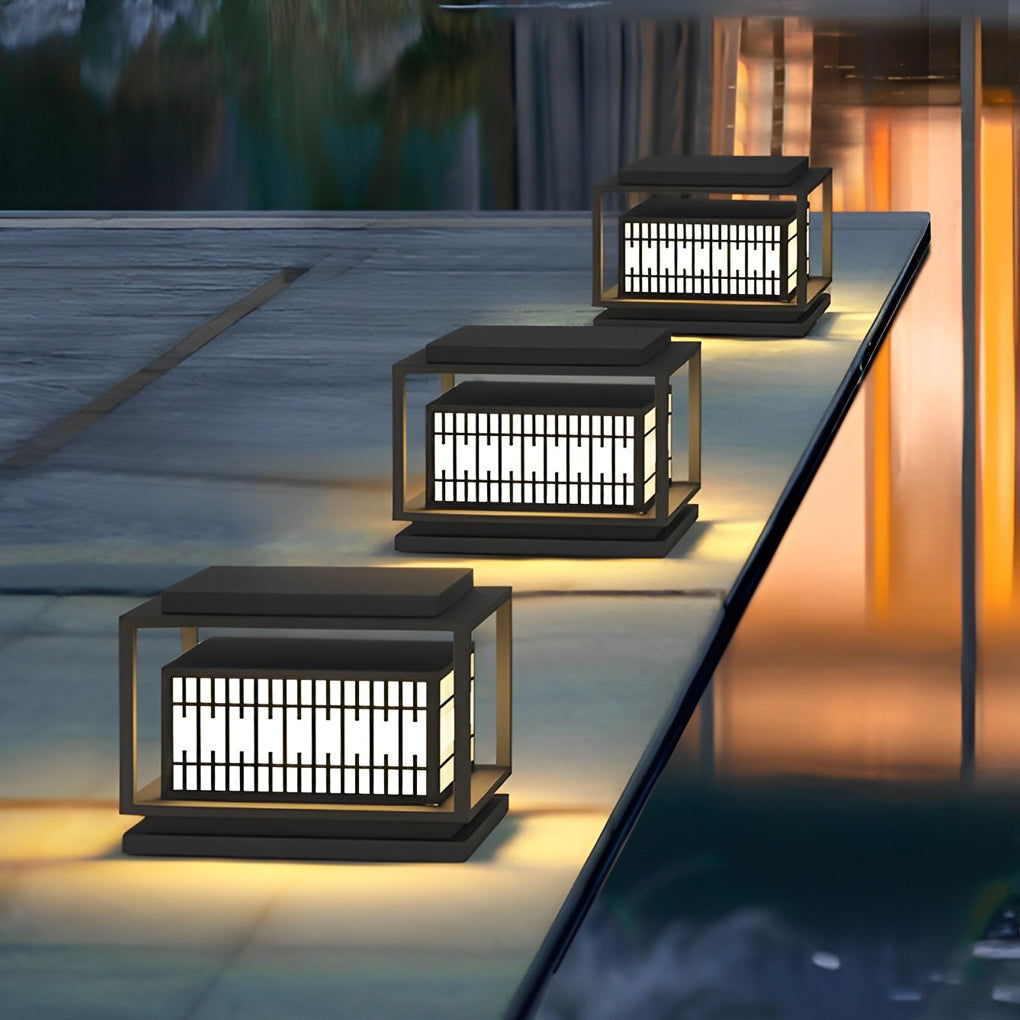 Bollard path lights illuminating a minimalist outdoor deck with focused glow.