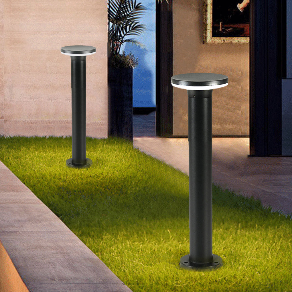 Pair of bollard pathway lights in black along a paved walkway, enhancing safety and aesthetics.