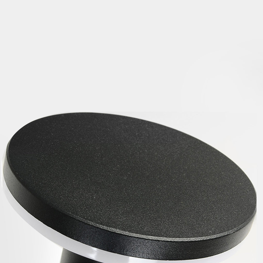 Top view of bollard pathway lights showing circular light diffusion and black finish.
