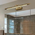Brass bathroom vanity light fixtures installed in contemporary bathroom with glass shower enclosure