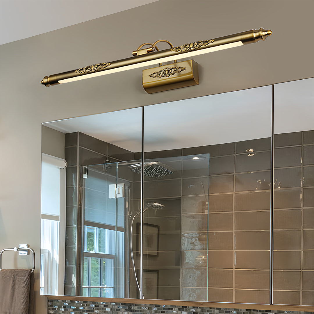 Brass bathroom vanity light fixtures installed in contemporary bathroom with glass shower enclosure