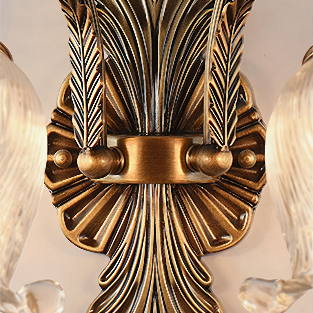 Detailed close-up of brass wall lights showing Art Nouveau inspired fanned backplate design