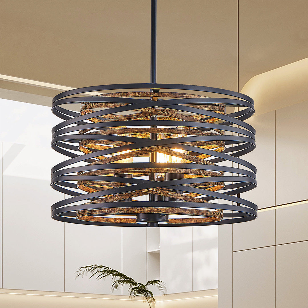 Black drum pendant light hanging in a bright kitchen, providing both ambient and task lighting.