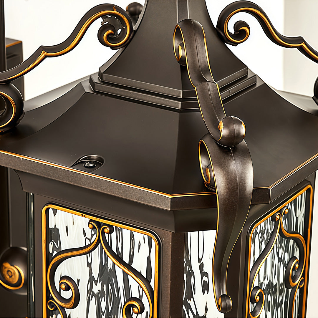 Detailed view of outdoor wall sconce lights top section with elegant bronze craftsmanship.