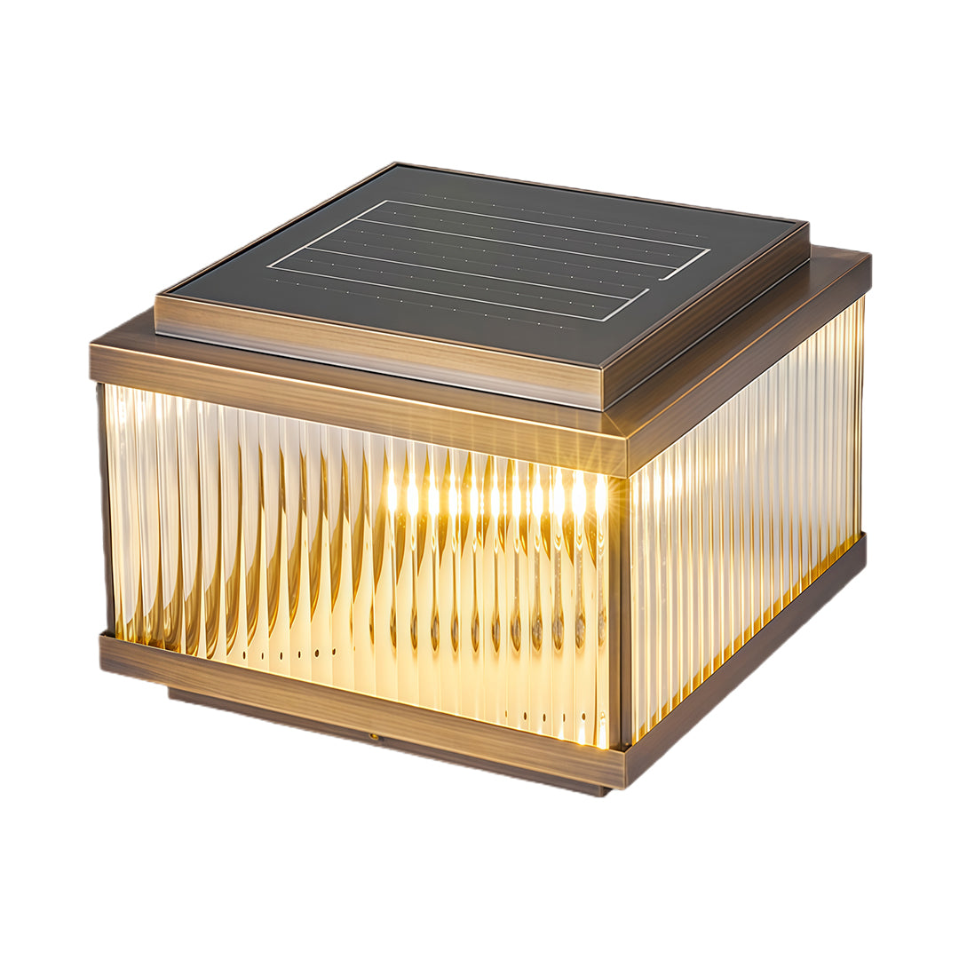 Square copper pillar light with warm LED illumination and textured corrugated glass panels on dark bronze frame.