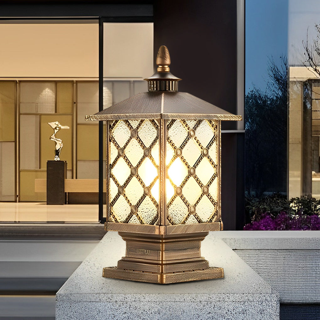 Bronze finish street light pillar with decorative glass on modern home exterior.