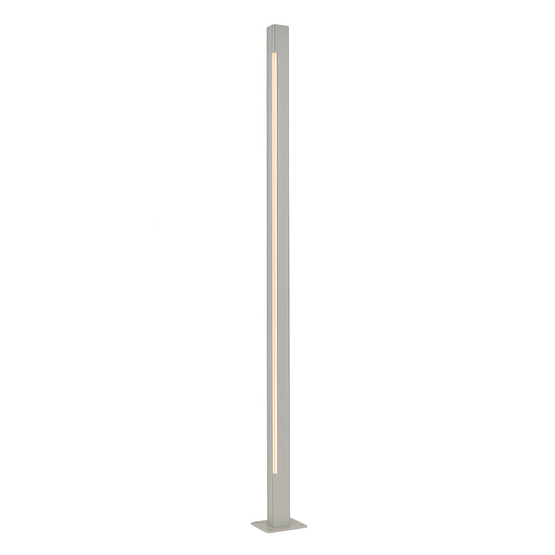 Exterior walkway illuminated by silver led bollard light fixtures installed along a modern building facade.