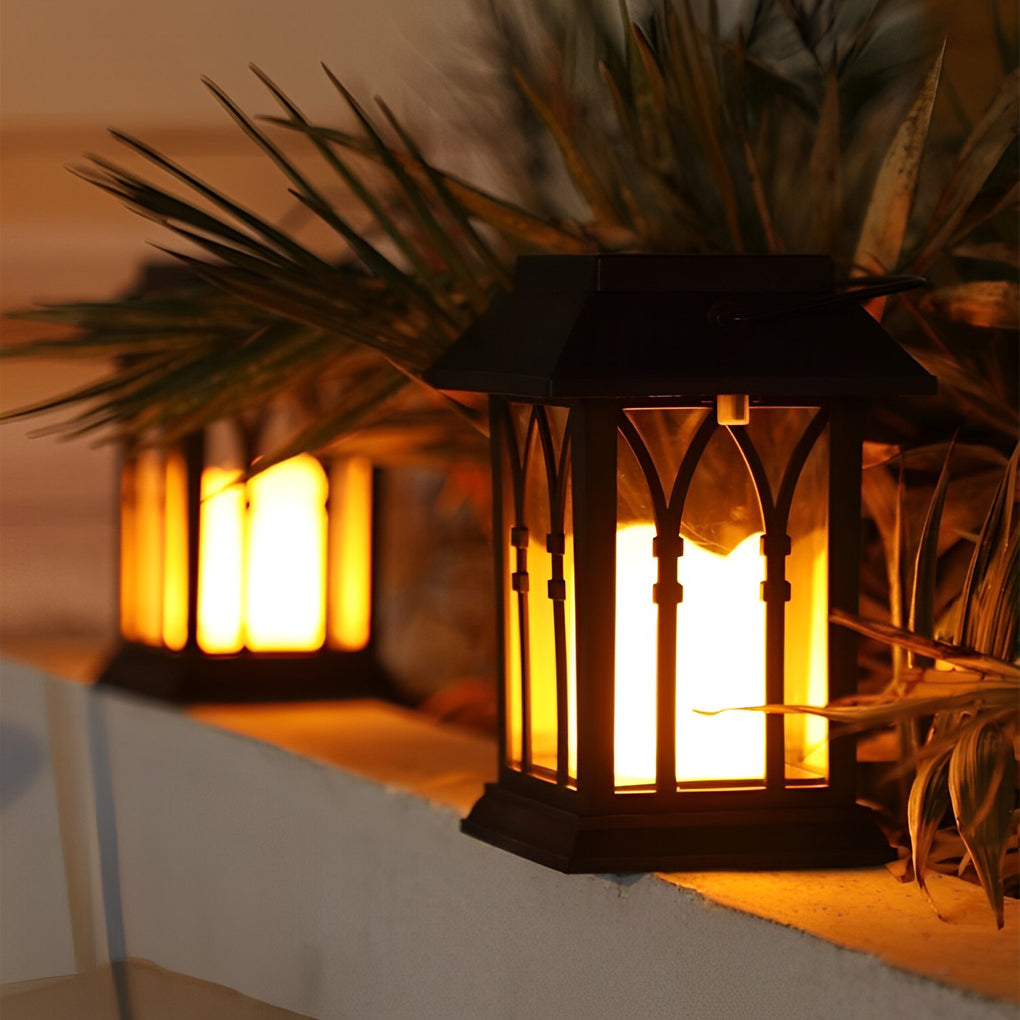 Candlestick lantern casting warm light on outdoor seating area.
