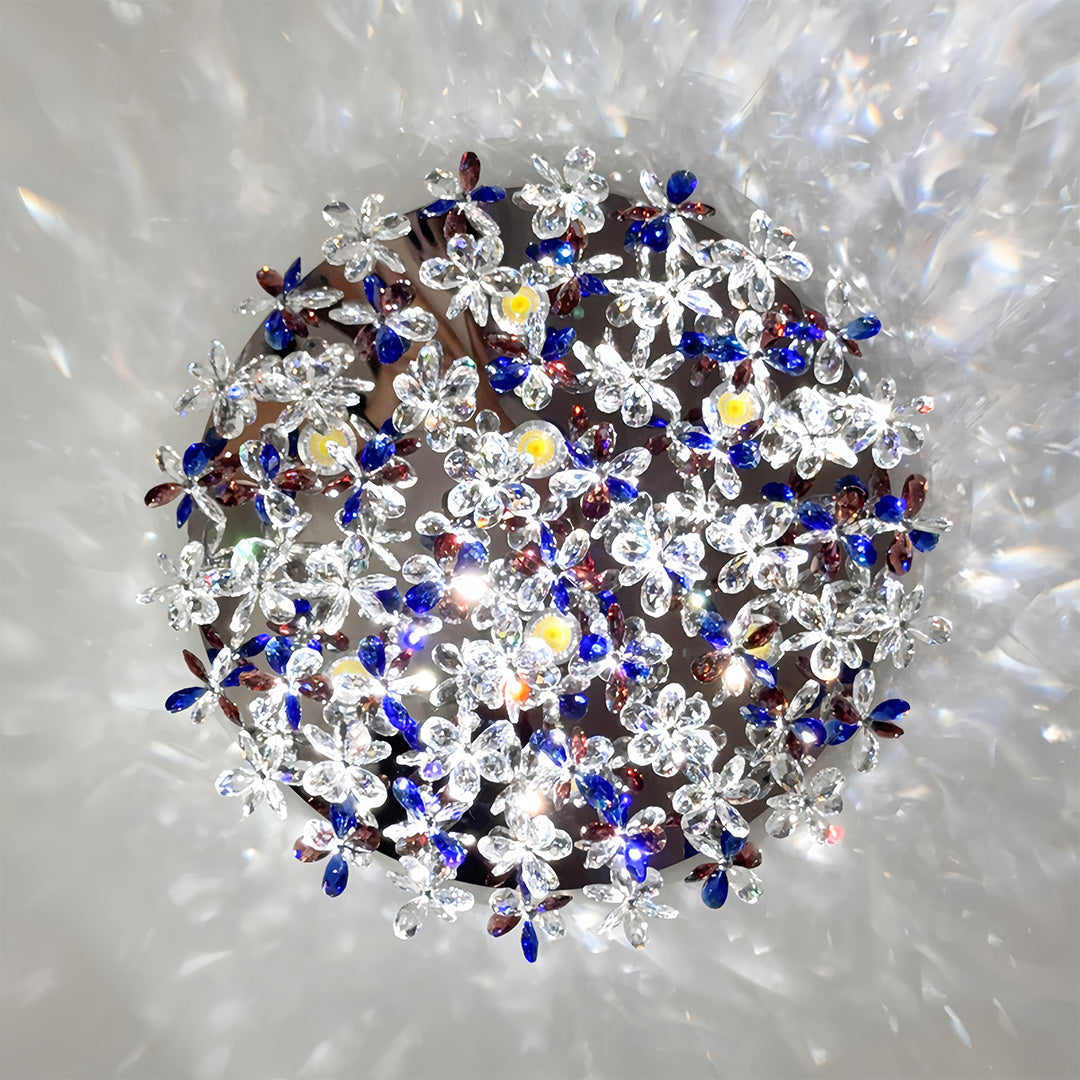 Sparkling crystal flush mount lights with cascading blue crystals creating brilliant light reflections