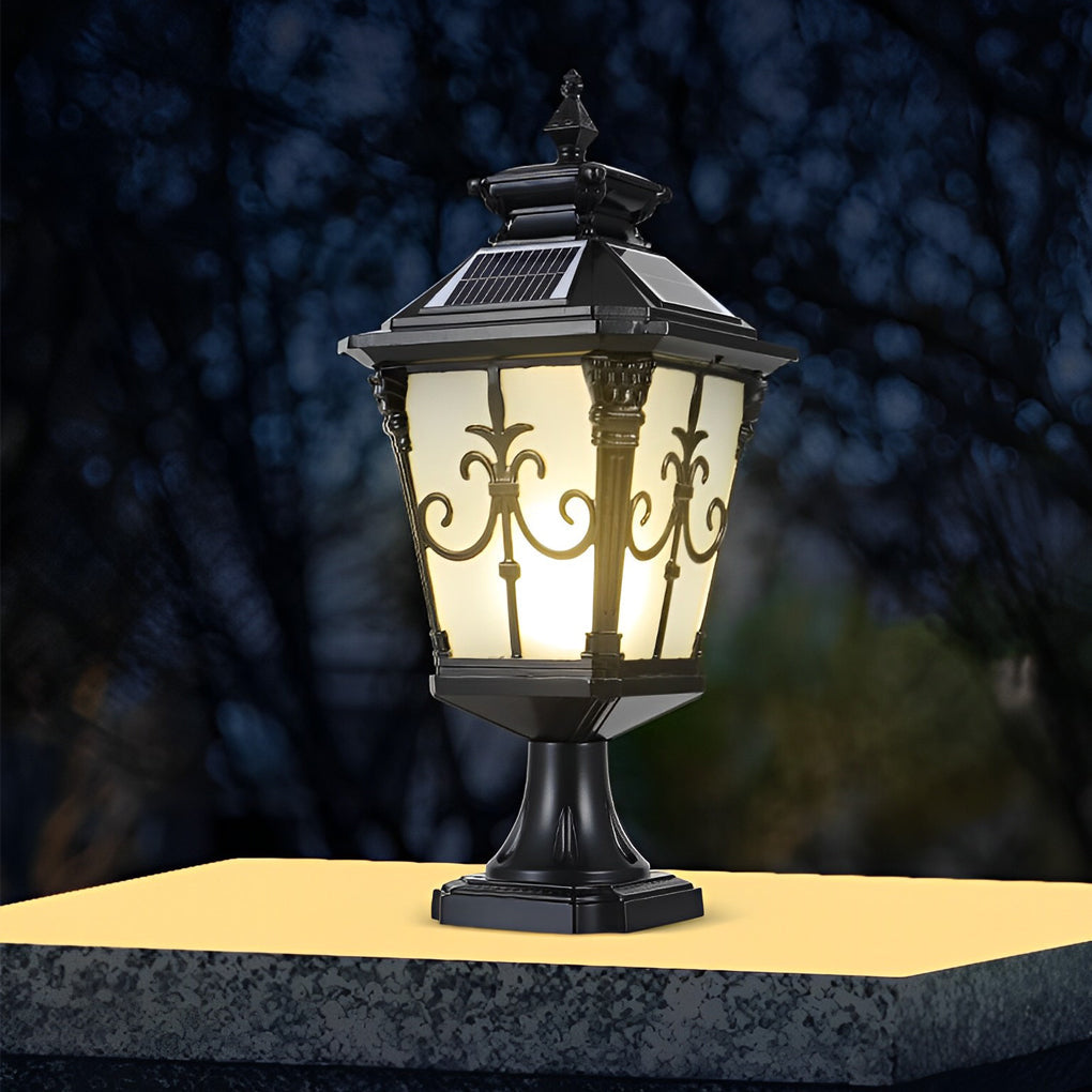 Cast aluminum post light with decorative bronze accents and frosted glass, mounted on a stone pillar.