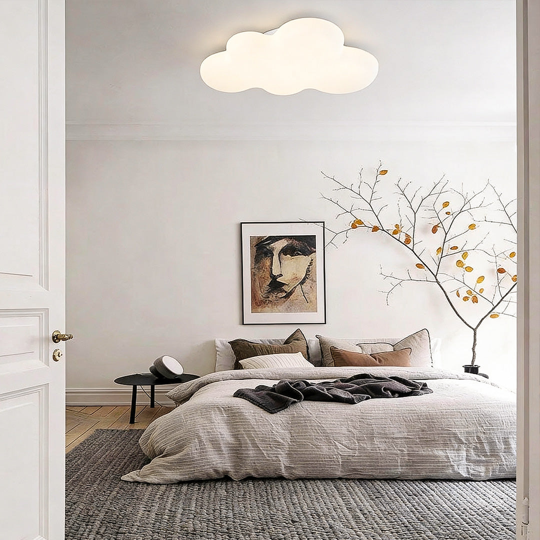 White ceiling cloud lights above bed in minimalist bedroom, gentle ambient lighting design.