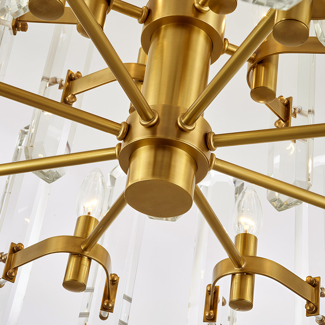 Modern luxury chandeliers close-up detail showcasing brass arms and crystal glass craftsmanship
