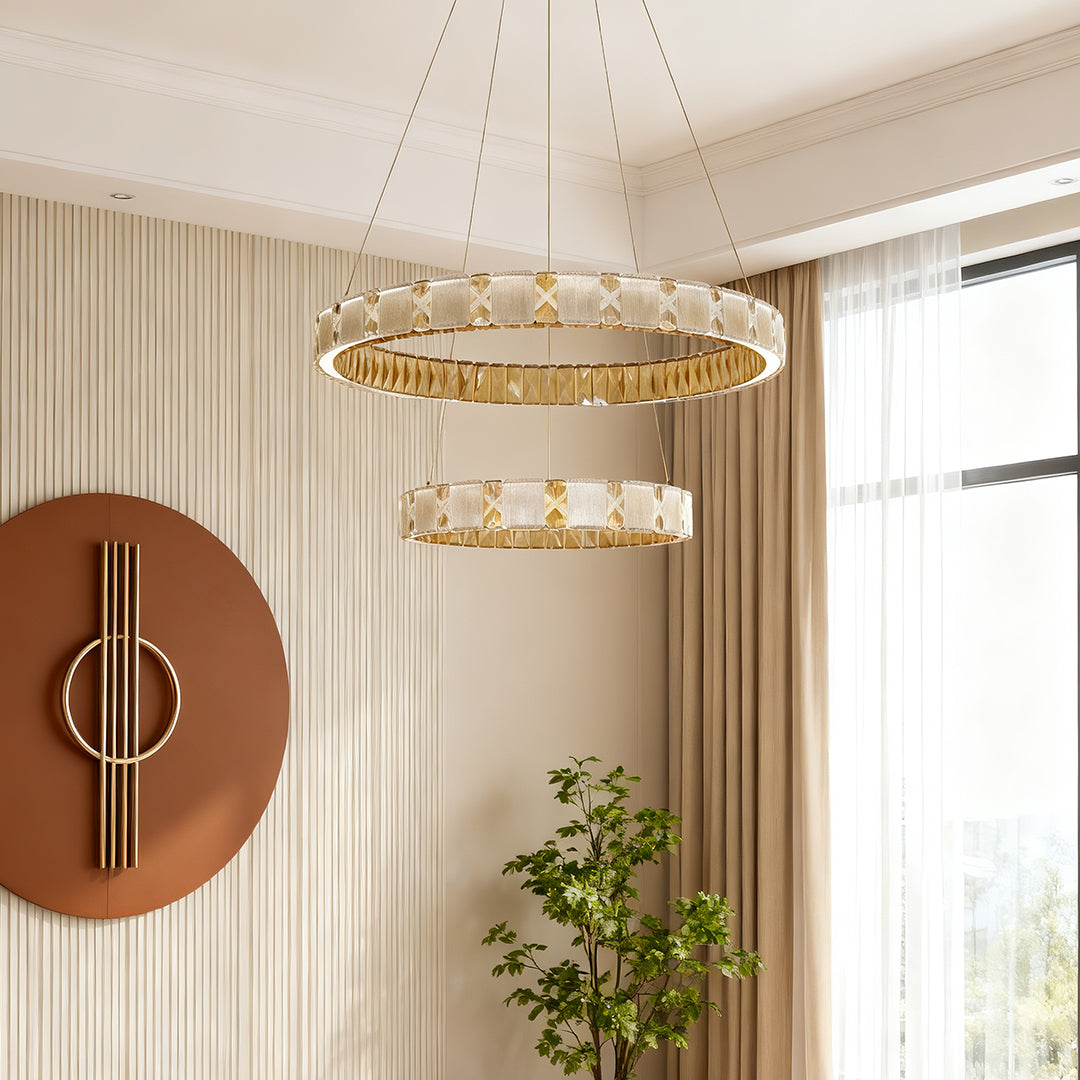 Chrome chandeliers installed in luxury dining room with warm ambient crystal illumination.