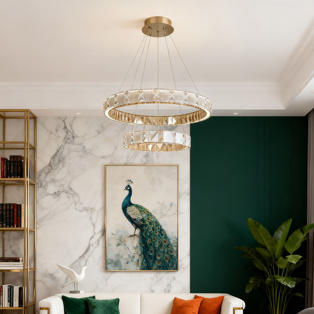 Chrome chandeliers creating sophisticated atmosphere in upscale residential dining and living space.