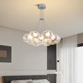 Multi light chandelier with chrome finish displaying multiple glass spheres in contemporary home environment