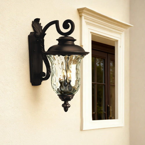 Classic black exterior wall light brightening textured beige wall beside white trim and doorway