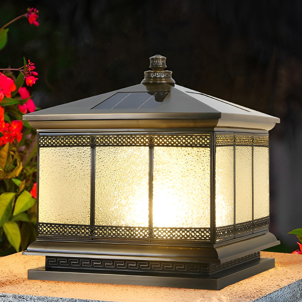 Classic waterproof outdoor pillar light with textured glass panels placed on a garden gate post.