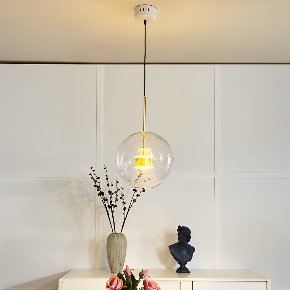 Clear bubble chandelier installed above kitchen island with modern cabinetry.