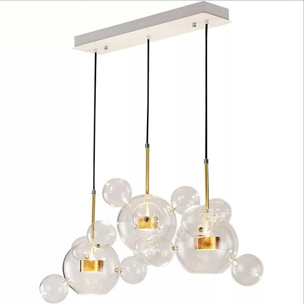 Cluster clear bubble chandelier creating sculptural lighting effect.