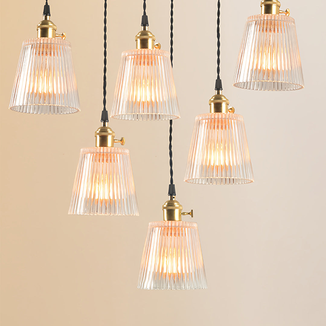 Clear glass pendant lights collection showcasing various heights and warm Edison bulb lighting