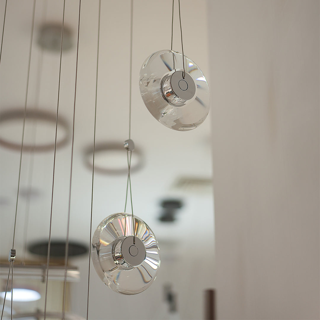 Clear pendant light with pivoting inner led ring offers adjustable illumination and elegant design for kitchens, dining areas, and living spaces.