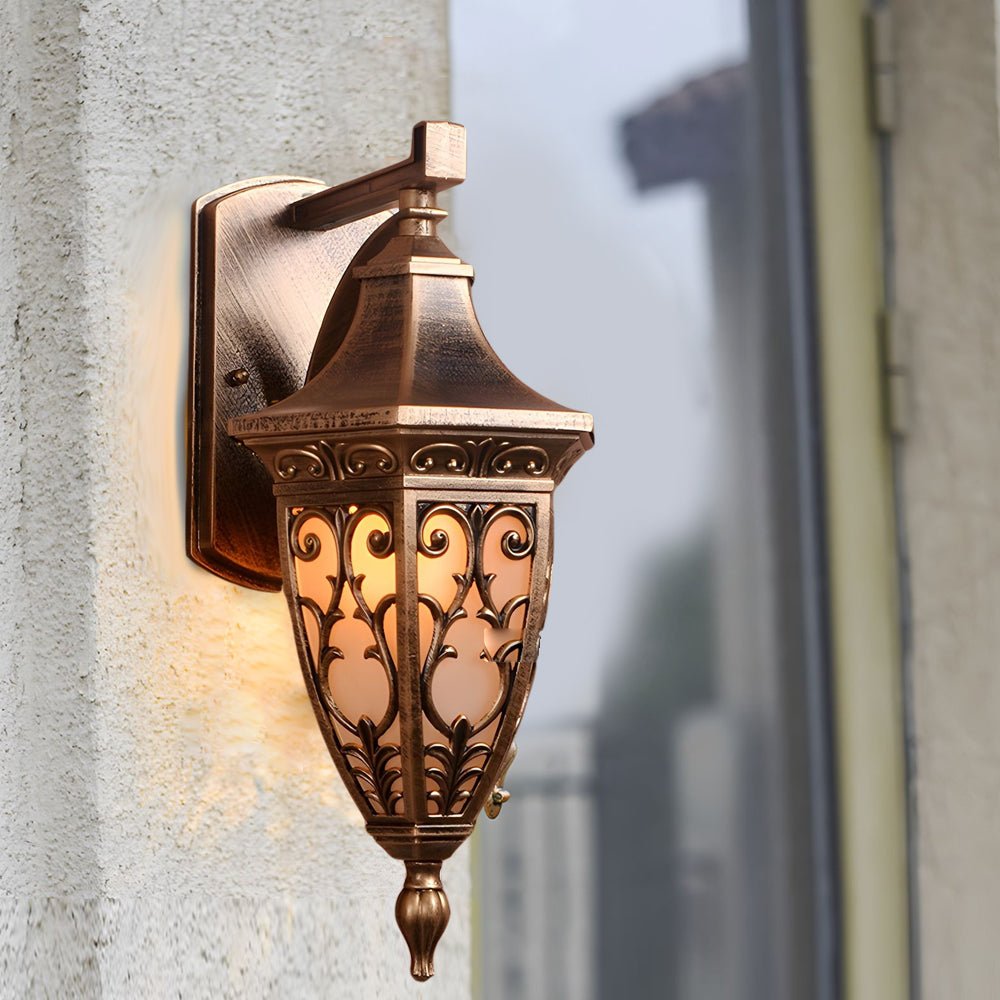 Close-up of antique art deco wall sconces showcasing detailed bronze craftsmanship and classic design elements.