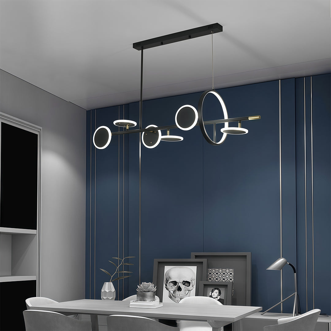 Close-up of the black-framed 6 light chandelier structure, showing the illuminated rings in a moody, dark-blue interior.
