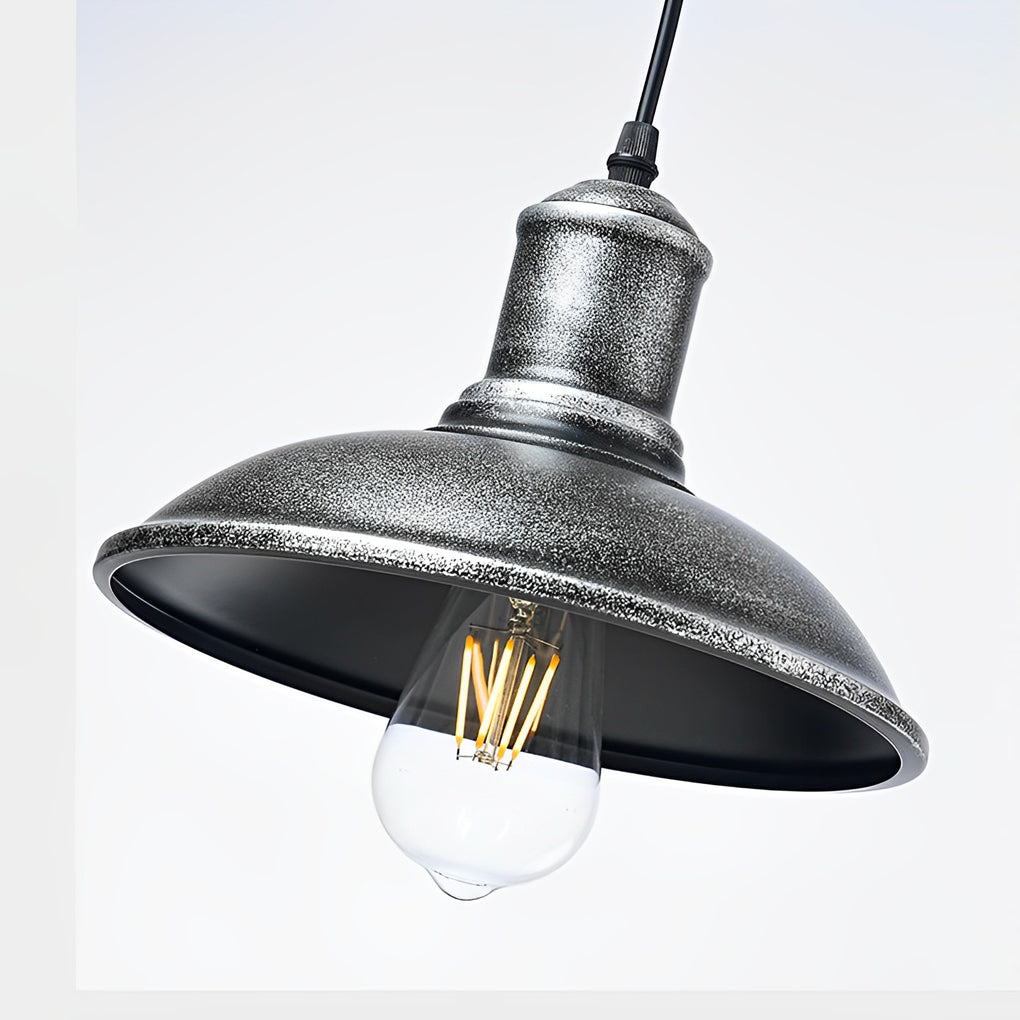 Close up of bronze pendant lighting showcasing its vintage design and Edison bulb.