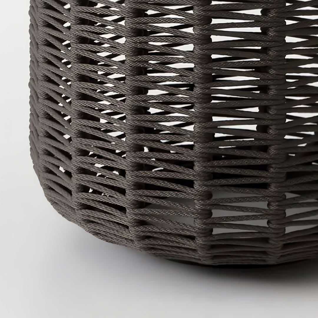 Close-up of the outdoor LED lantern base, showcasing the dense, dark brown woven resin material and the sturdy construction.
