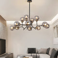 Glass globe chandelier with a close-up of the glass globes, showcasing the intricate design and light reflection.
