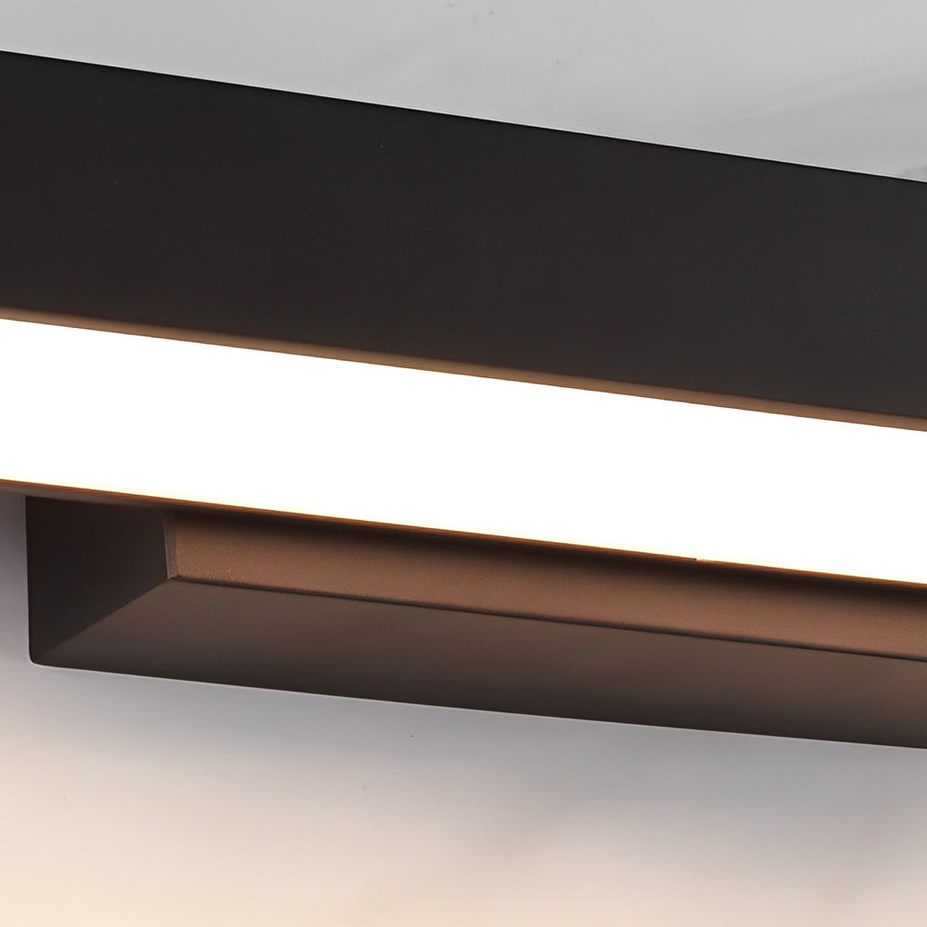 Close up view of a black LED linear wall light showing continuous LED strip and sleek rectangular housing.