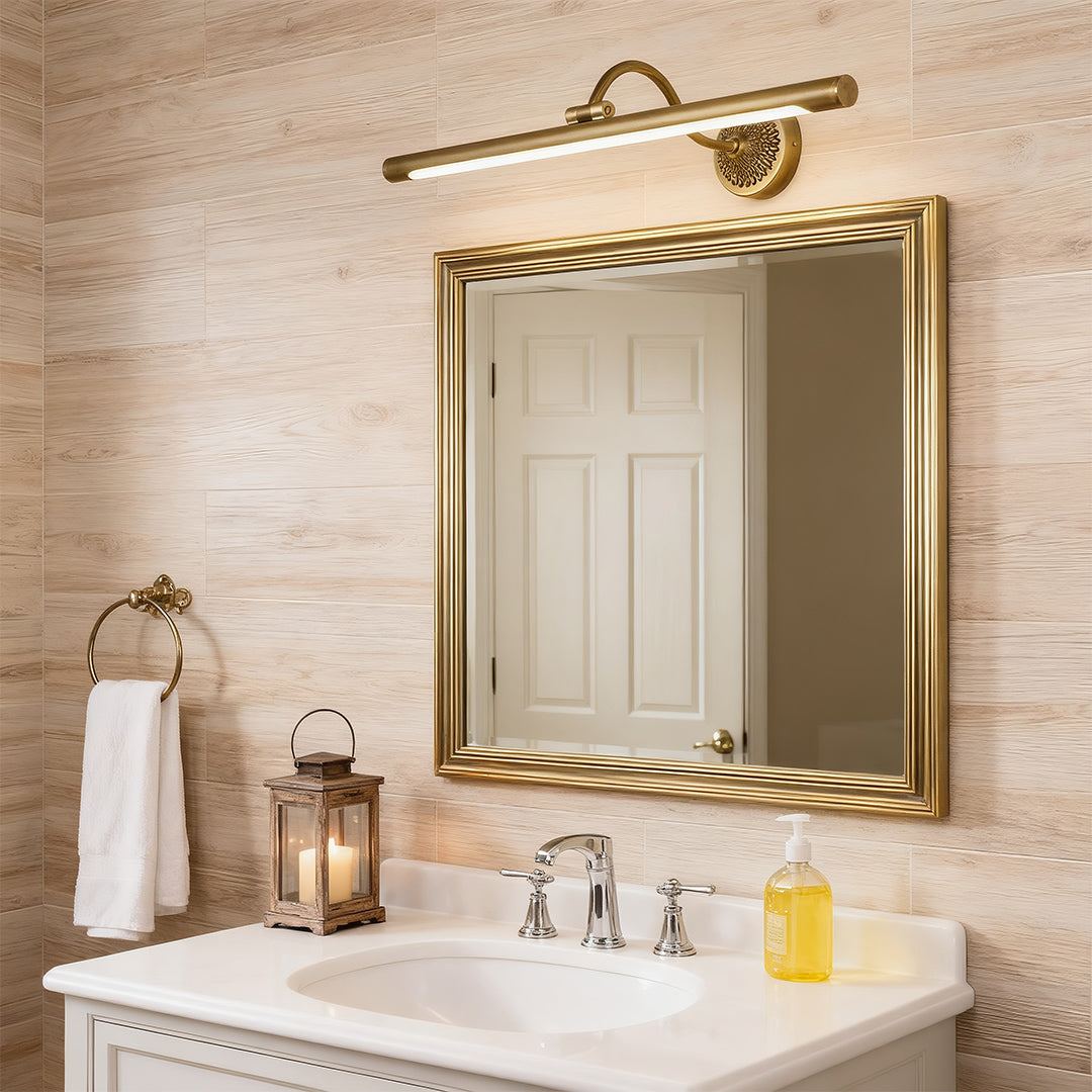 Close-up of LED vanity bathroom lights, showcasing the detailed brass finish and adjustable arm.