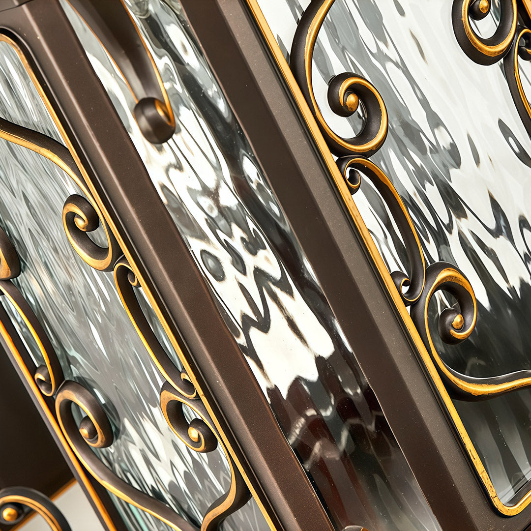 Close-up view of outdoor wall sconce lights showing fine metal texture and golden accents.