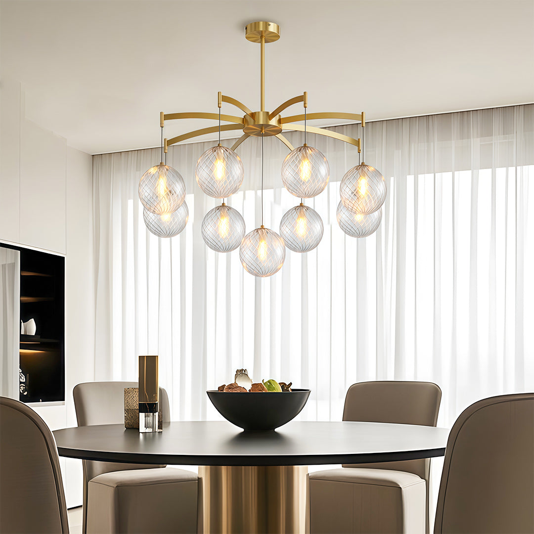 Close up of a modern glass ball chandelier showcasing the intricate glass ball details and warm lighting.