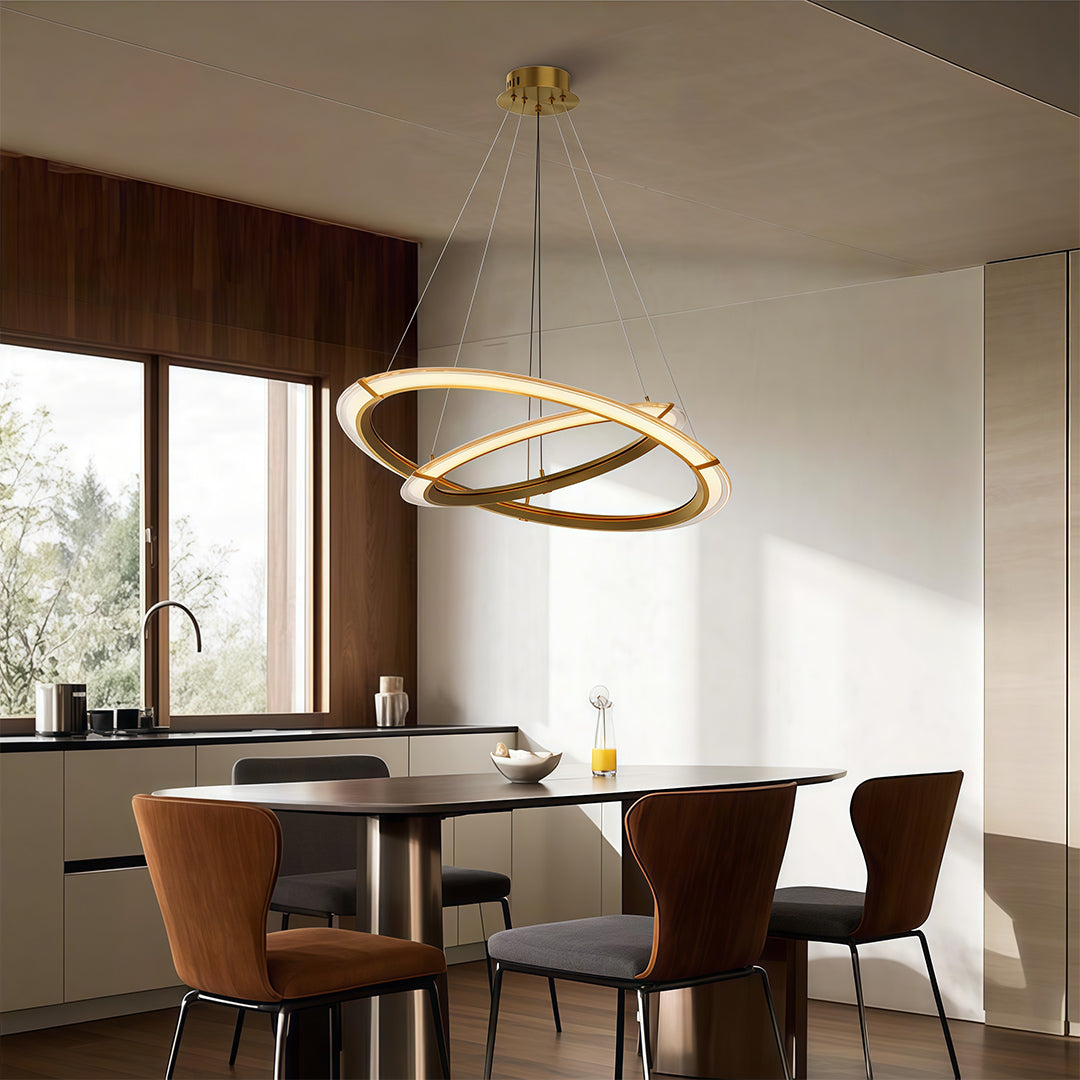 Close up of a modern round chandelier highlighting the gold finish and circular design.