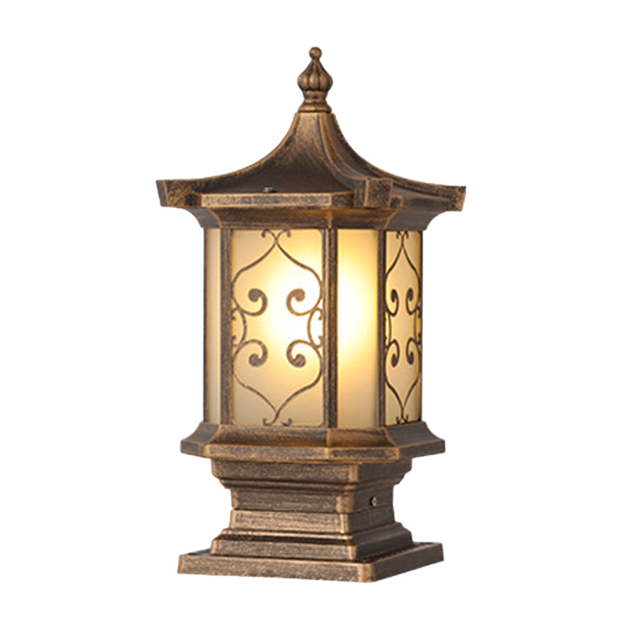 Close-up of outdoor gate pillar lights, highlighting detailed craftsmanship and warm light effect.