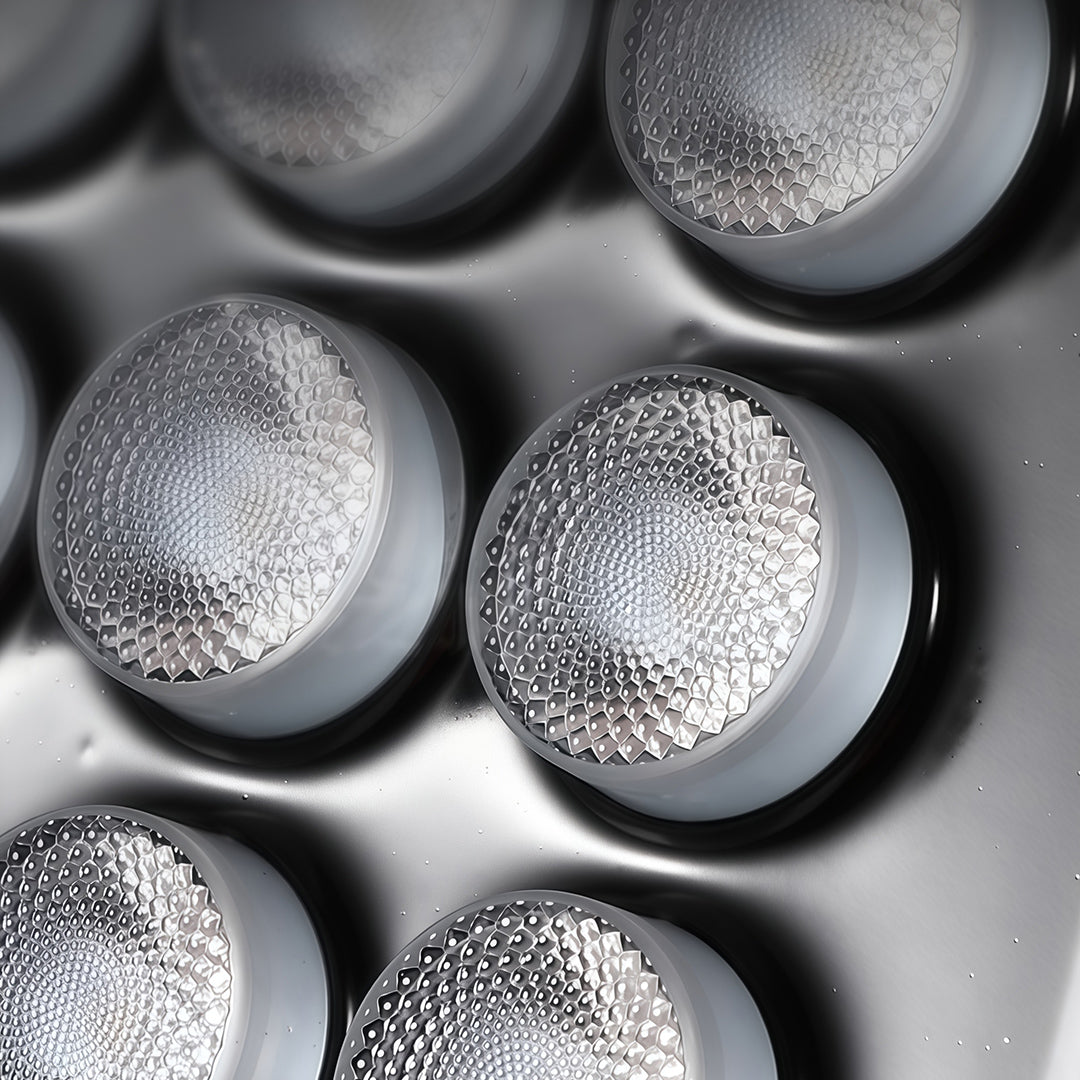 Extreme close-up of the individual textured LED lenses within a powerful architectural flood lights panel.